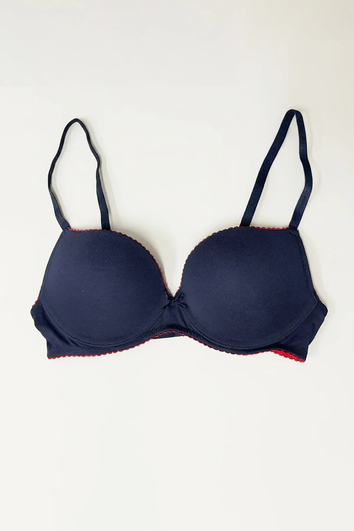 Cosima Wired Push Up Bra Navy – Flat lay showing cup shape and red lace trim